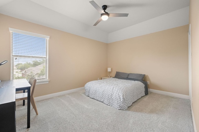 carpeted bedroom with a ceiling fan, baseboards, and lofted ceiling