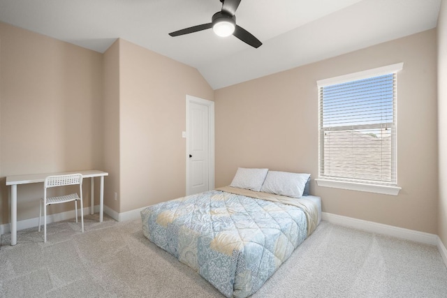 bedroom with vaulted ceiling, baseboards, a ceiling fan, and carpet flooring