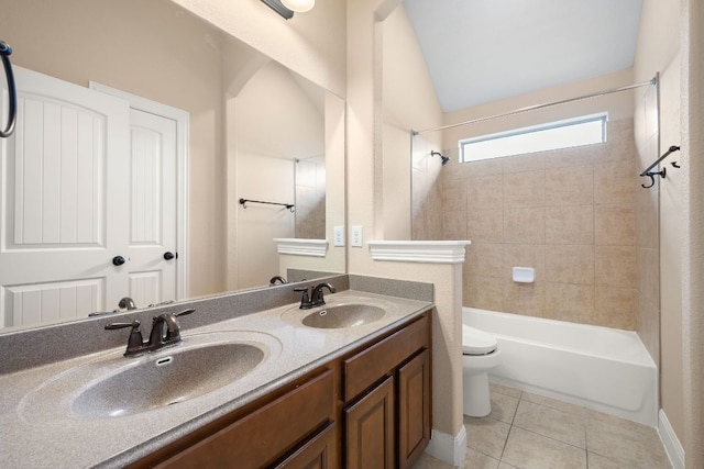 full bathroom featuring a sink, tile patterned floors, toilet, and double vanity