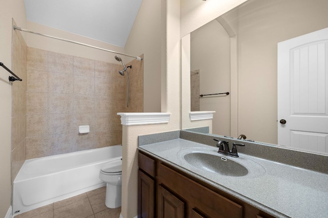 bathroom with toilet, tile patterned floors, bathing tub / shower combination, and vanity