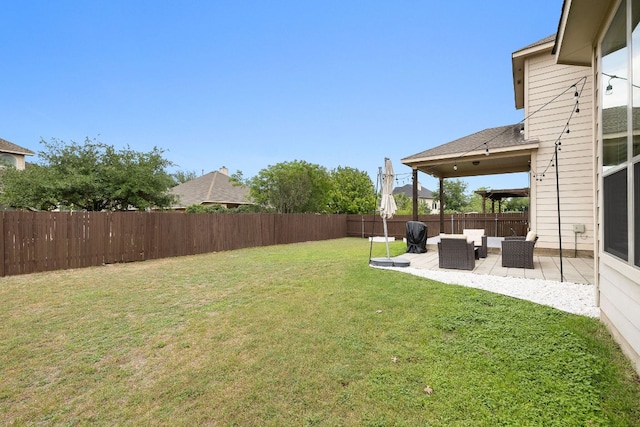view of yard with an outdoor hangout area, a patio, and a fenced backyard