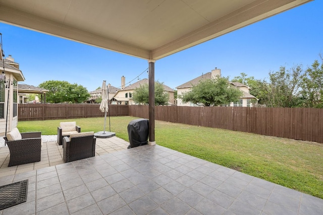 view of patio with a fenced backyard and area for grilling