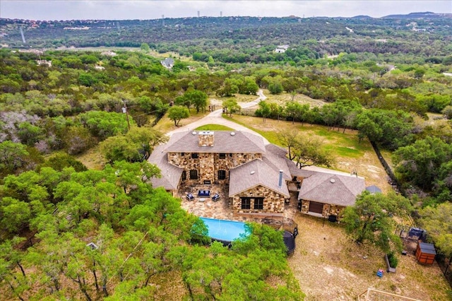 drone / aerial view with a view of trees