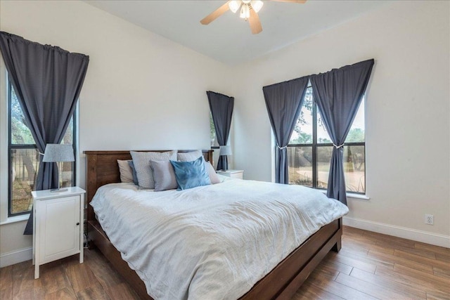 3904 Bee Creek Rd, Spicewood, TX 78669 - bedroom featuring baseboards, wood finished floors, and ceiling fan