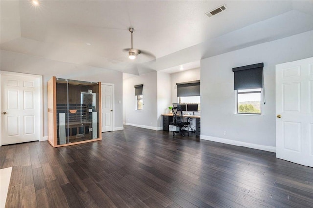 living area featuring baseboards, a ceiling fan, dark wood finished floors, and visible vents