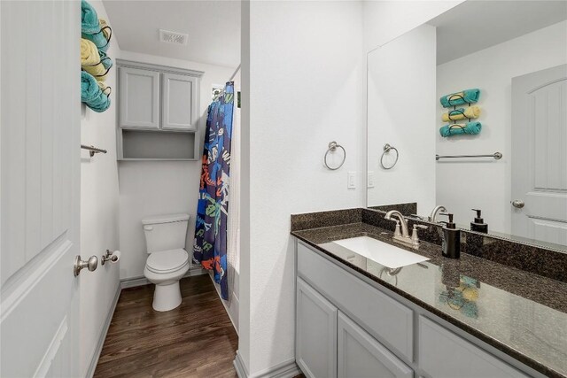 4118 Cripple Creek Dr, Temple, TX 76502 - full bathroom with vanity, wood finished floors, toilet, and baseboards
