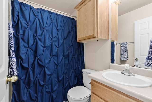 full bath featuring vanity, toilet, and curtained shower
