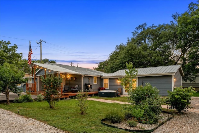 120 Highland Ln, Kingsland, TX 78639 - ranch-style house featuring a front yard, a metal roof, and a deck