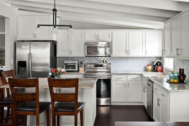 120 Highland Ln, Kingsland, TX 78639 - kitchen with stainless steel appliances, decorative backsplash, white cabinets, light stone countertops, and dark wood-style floors