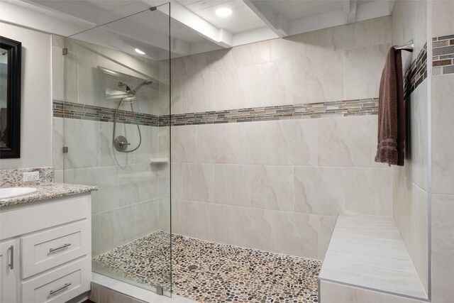 full bathroom featuring vanity and walk in shower