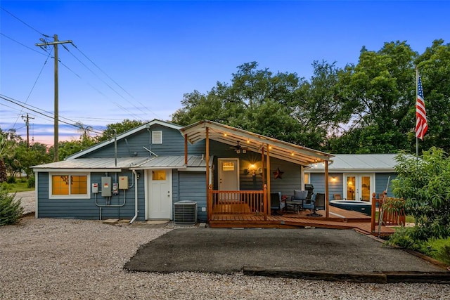 120 Highland Ln, Kingsland, TX 78639 - view of front of house with a metal roof and a deck