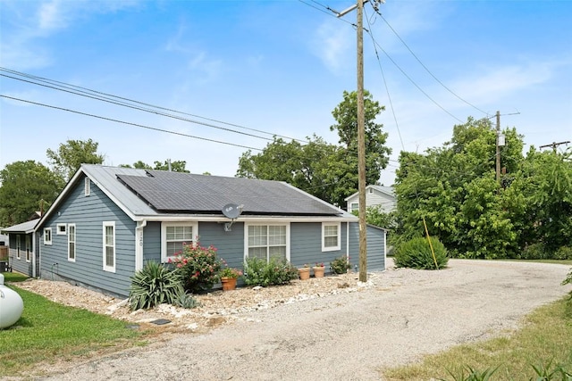 120 Highland Ln, Kingsland, TX 78639 - view of property exterior with roof mounted solar panels