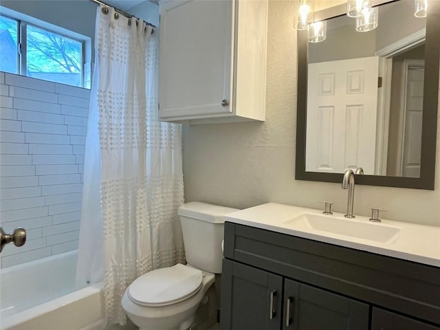 bathroom featuring toilet, a textured wall, shower / bathtub combination with curtain, and vanity