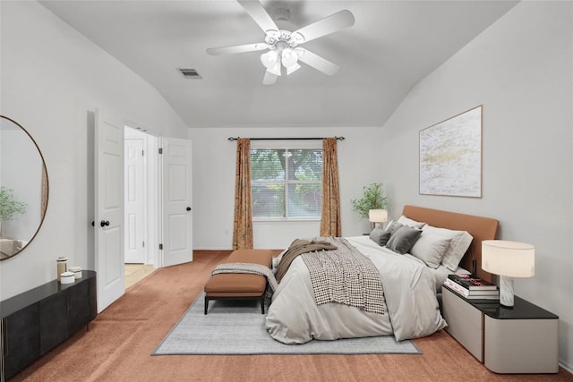 bedroom featuring carpet floors, a ceiling fan, vaulted ceiling, and visible vents