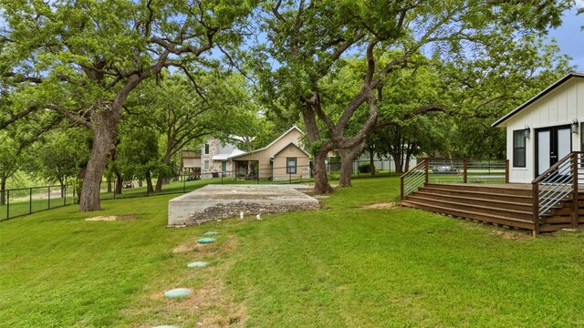view of yard with a fenced backyard and a deck