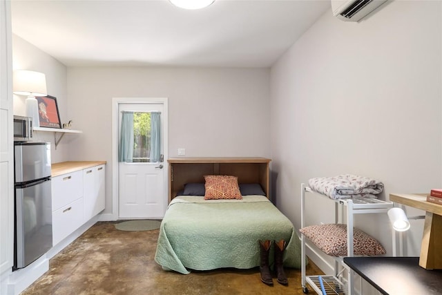 bedroom with freestanding refrigerator, concrete floors, and a wall mounted air conditioner