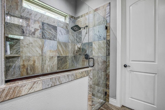 full bath featuring a shower stall