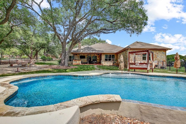 view of swimming pool with fence and a fenced in pool