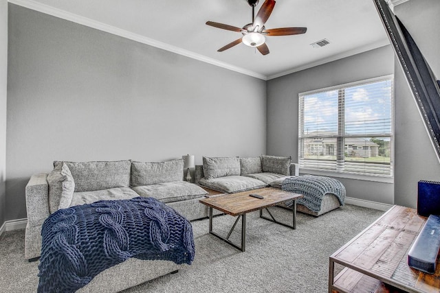 living area with crown molding, carpet floors, a ceiling fan, baseboards, and visible vents