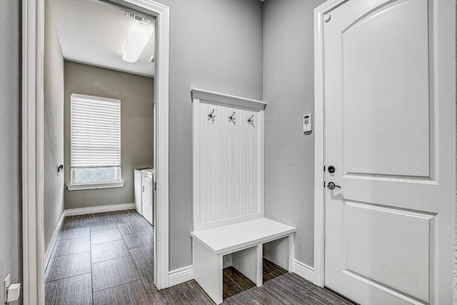 mudroom featuring baseboards and wood finished floors