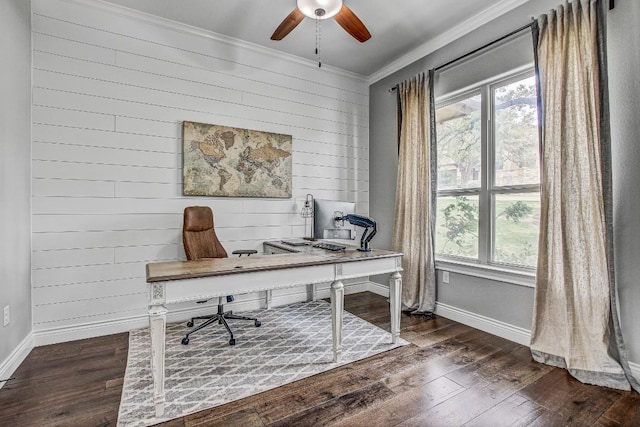 office with ceiling fan, wood finished floors, baseboards, wooden walls, and ornamental molding