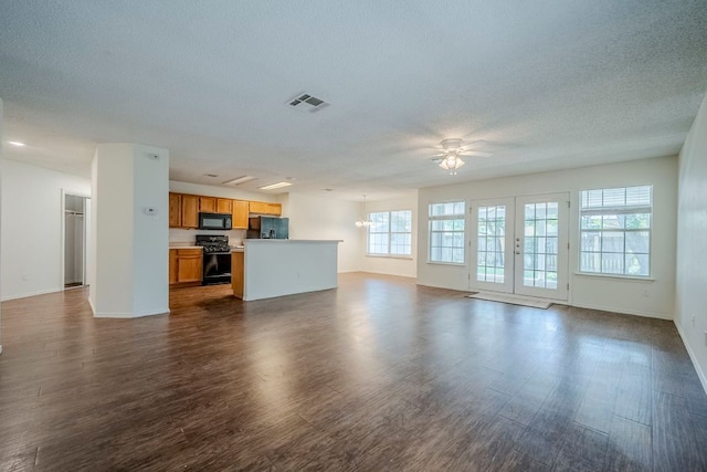 1911 Timberwood Dr, Cedar Park, TX 78613 - unfurnished living room with a ceiling fan, dark wood-style flooring, baseboards, and a textured ceiling