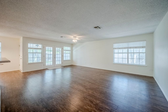 1911 Timberwood Dr, Cedar Park, TX 78613 - empty room featuring a ceiling fan, dark wood-style flooring, a textured ceiling, and baseboards