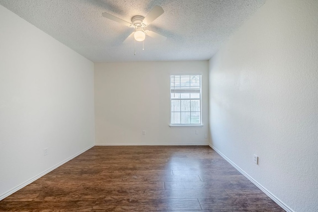 1911 Timberwood Dr, Cedar Park, TX 78613 - spare room featuring a textured ceiling, a ceiling fan, wood finished floors, and baseboards