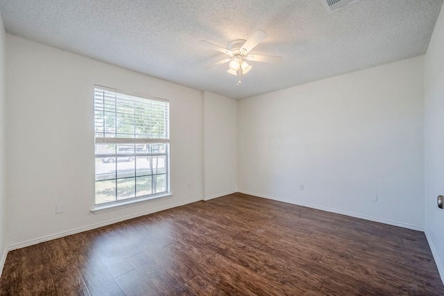 1911 Timberwood Dr, Cedar Park, TX 78613 - unfurnished room featuring ceiling fan, dark wood-style flooring, a textured ceiling, and baseboards