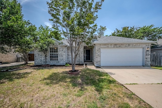 1911 Timberwood Dr, Cedar Park, TX 78613 - view of front of home with driveway, brick siding, and an attached garage