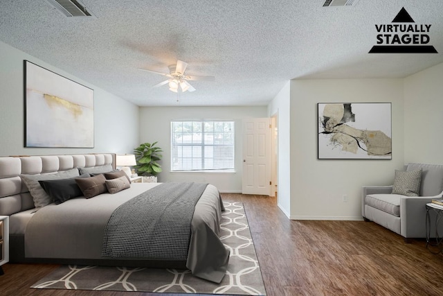 1911 Timberwood Dr, Cedar Park, TX 78613 - bedroom featuring wood finished floors, a textured ceiling, ceiling fan, and baseboards