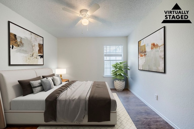 1911 Timberwood Dr, Cedar Park, TX 78613 - bedroom with wood finished floors, a textured ceiling, ceiling fan, and baseboards