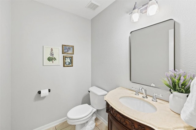 half bathroom featuring tile patterned flooring, vanity, toilet, baseboards, and visible vents