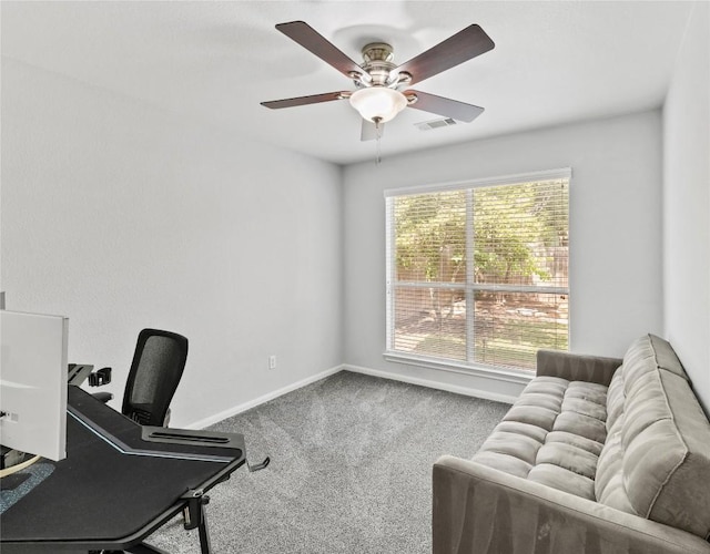 home office featuring visible vents, a ceiling fan, baseboards, and carpet floors