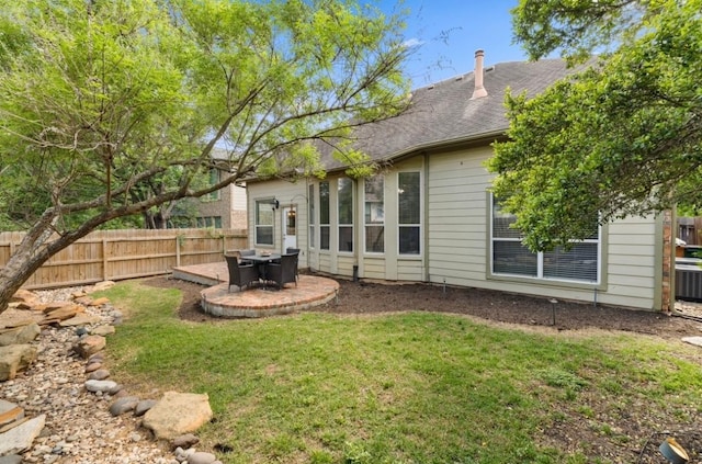 view of yard with fence and a patio