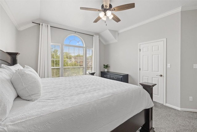 bedroom with crown molding, lofted ceiling, baseboards, ceiling fan, and carpet