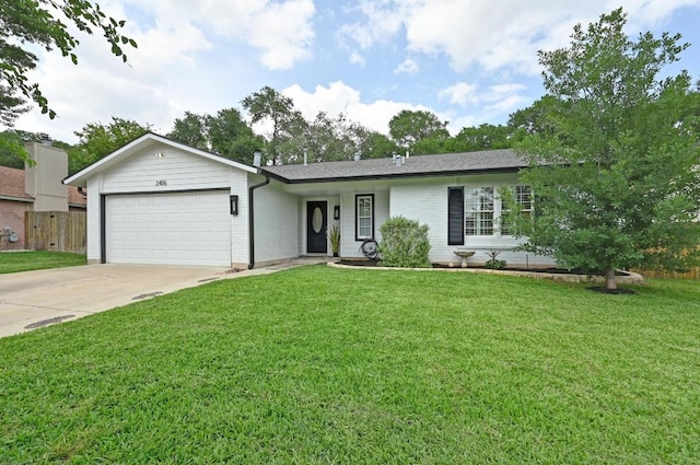 ranch-style house featuring driveway, a front yard, and a garage