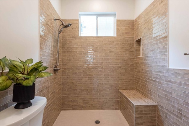 full bathroom featuring tiled shower