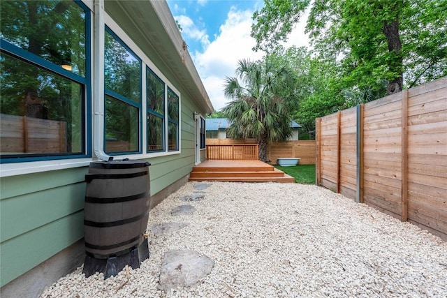 view of patio with a fenced backyard and a deck