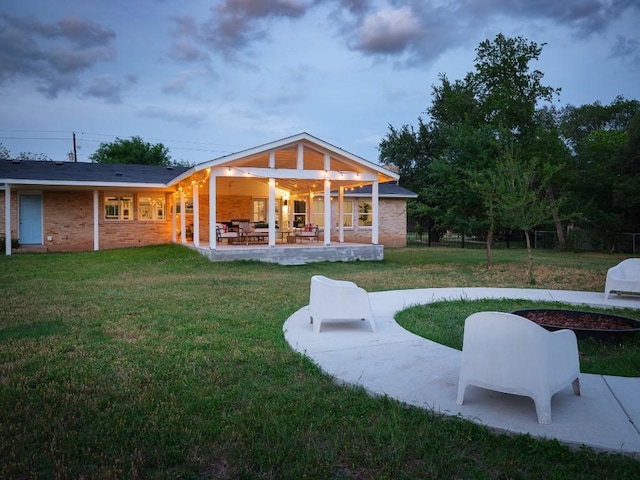 5203 Branding Chase St, Austin, TX 78727 - back of property with a lawn and a patio