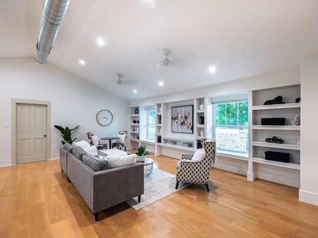5203 Branding Chase St, Austin, TX 78727 - living area featuring light wood finished floors, built in shelves, a ceiling fan, recessed lighting, and lofted ceiling