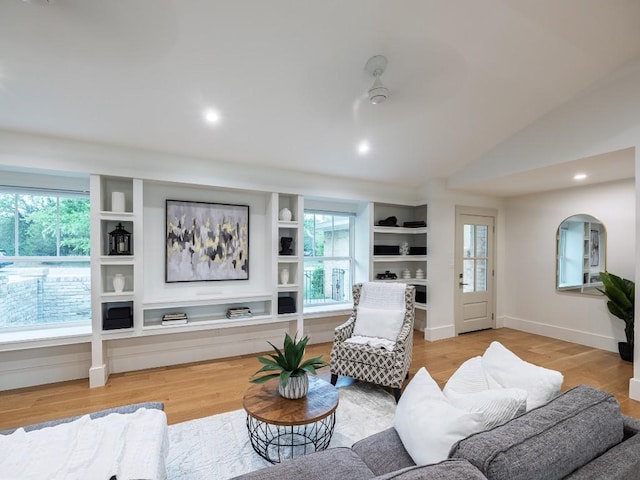 5203 Branding Chase St, Austin, TX 78727 - living room featuring baseboards, recessed lighting, light wood-style flooring, and vaulted ceiling