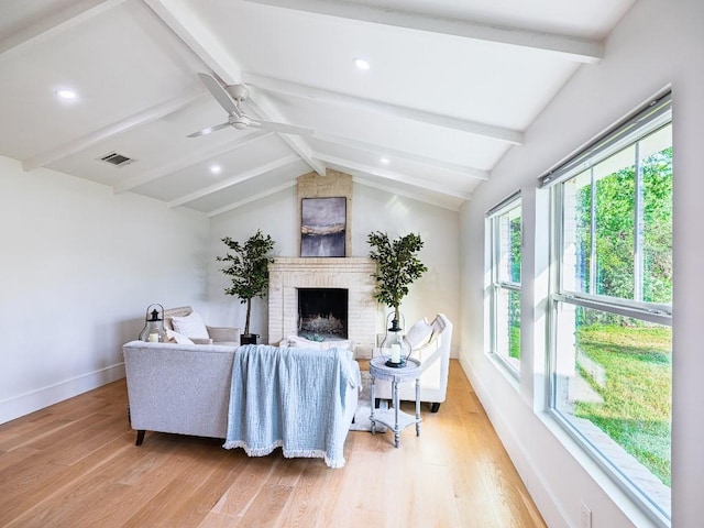 5203 Branding Chase St, Austin, TX 78727 - living area featuring ceiling fan, light wood-style floors, a brick fireplace, baseboards, and visible vents