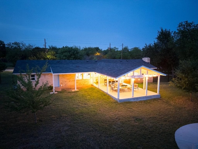 5203 Branding Chase St, Austin, TX 78727 - back of property with a patio area, a yard, a chimney, and a carport