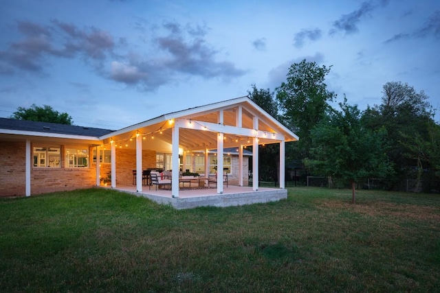 5203 Branding Chase St, Austin, TX 78727 - rear view of house with a lawn and a patio area