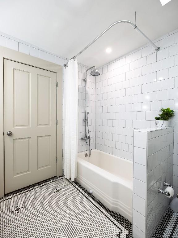 5203 Branding Chase St, Austin, TX 78727 - bathroom with tile patterned flooring and shower / bath combination with curtain