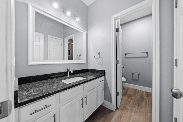 1214 Vargas Rd Unit B, Austin, TX 78741 - bathroom featuring wood finished floors and vanity