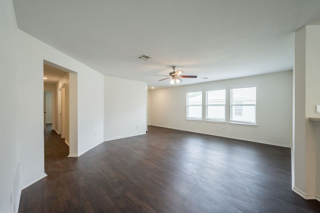 292 Dandelion Loop, Kyle, TX 78640 - empty room with a ceiling fan, dark wood-style floors, and baseboards