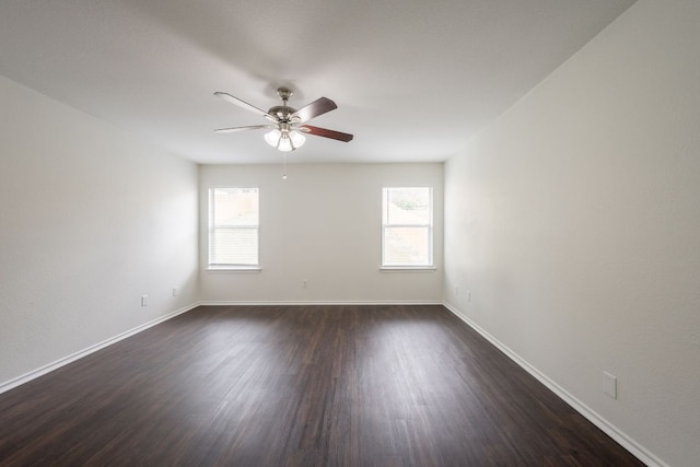 292 Dandelion Loop, Kyle, TX 78640 - empty room with plenty of natural light, a ceiling fan, and dark wood-style flooring