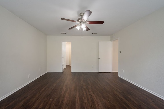 292 Dandelion Loop, Kyle, TX 78640 - spare room featuring dark wood-type flooring, a ceiling fan, and baseboards